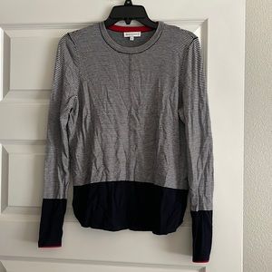 Women’s navy blue and white long sleeve shirt with red details